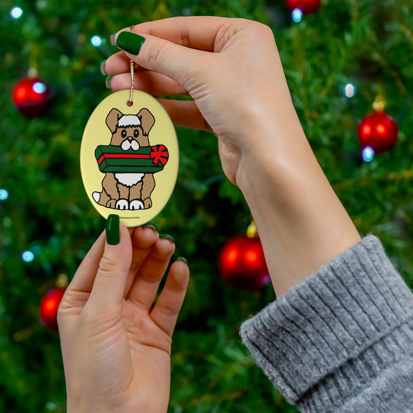 Holiday Dog with Gift Oval Ceramic Ornament